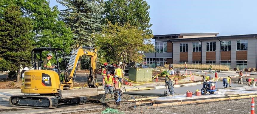 A photo of work crews and equipment pouring concrete for the new roundabout.