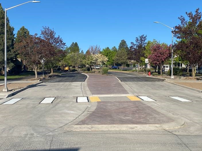 A photo of the crosswalk striping completed on the west leg of the roundabout.