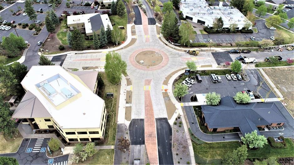 An aerial photo of the Colorado Ave./Columbia St. roundabout as of May 7, 2021. Roadway tie-ins are complete and crews are starting landscaping.