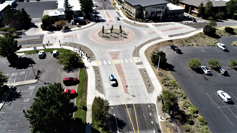 An aerial photo looking west over traffic using the recently opened Columbia St & Simpson Ave roundabout.