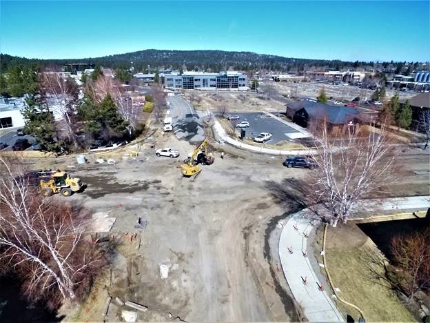 An aerial picture overlooking work crews, equipment, and the Colorado/Columbia intersection construction site as of March 26, 2021.