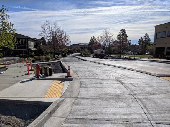 A photo of the east leg of the roundabout on Colorado Ave. Work crews are prepping for transition from existing asphalt to the new cement.
