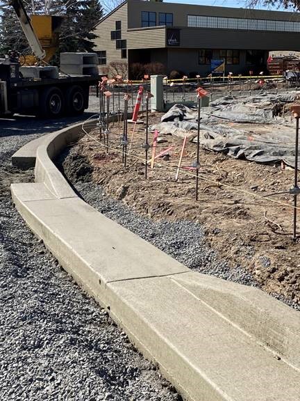 A photo of a freshly finished curb.