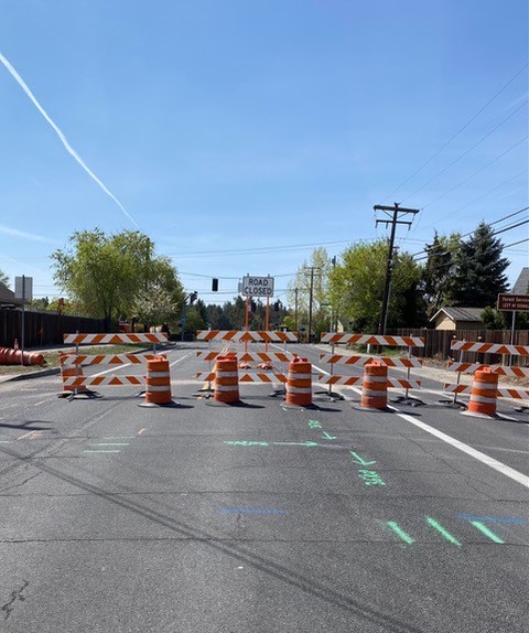 A picture of the road closure barricade and signage at NE Purcell Blvd facing south.