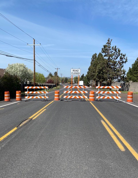 A picture of the road closure barricade and signage at Butler Market Rd. facing west.