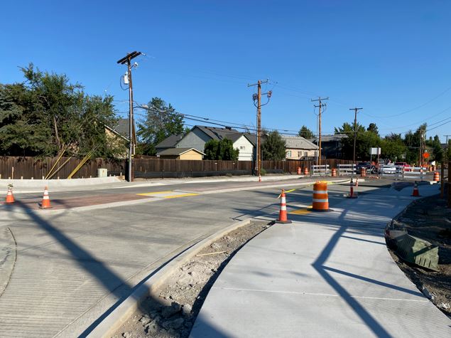 A photo of the NE Purcell Blvd & NE Butler Market Road roundabout facing north.