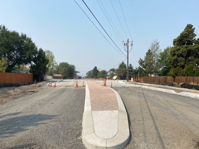 A photo of NE Purcell & NE Butler Market Road facing west.