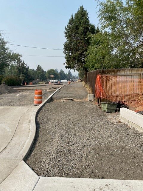 A photo of the sidewalk prep work along NE Butler Market Road facing east.
