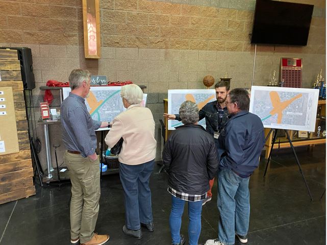 A photo of Mt. View Neighborhood Association residents talking with project team members about the Empire Corridor Improvements Project.