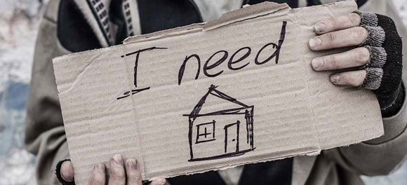 Man holding a sign that says 