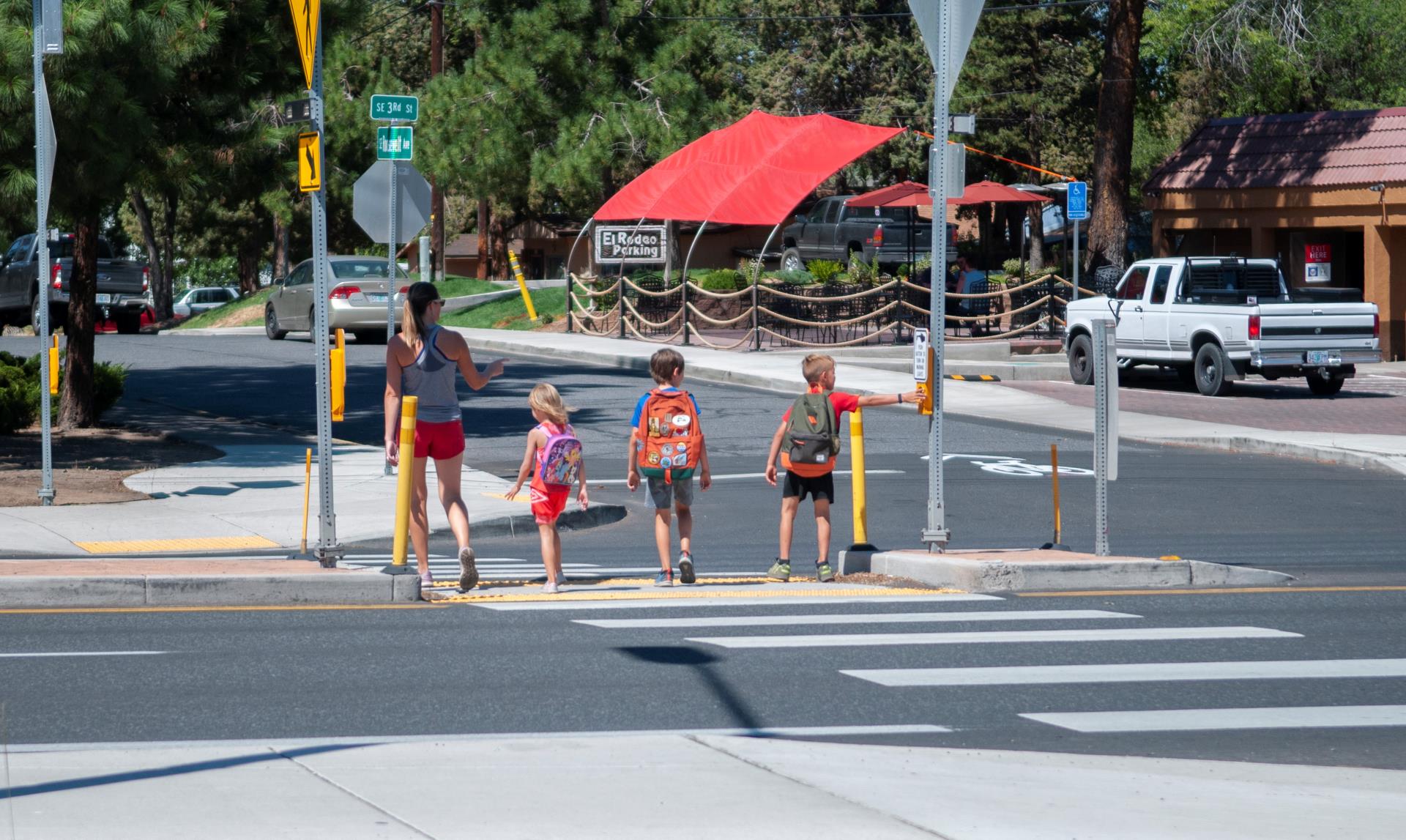 Children crossing the street at a crosswalk in Bend.