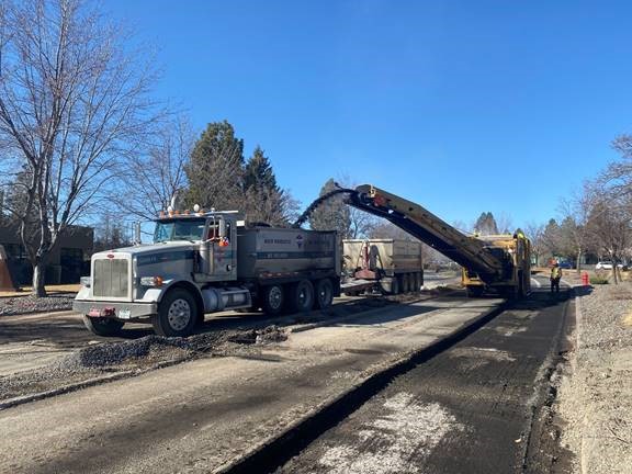 A photo of work crews and equipment performing asphalt removal along the west leg of the Colorado Ave./Columbia St. intersection.