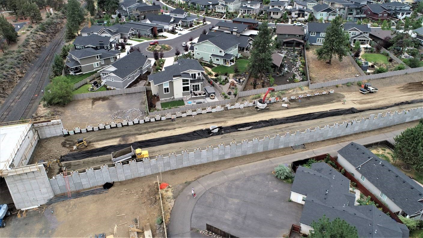 An aerial photo looking south over the retaining wall for the new Murphy Road extension.