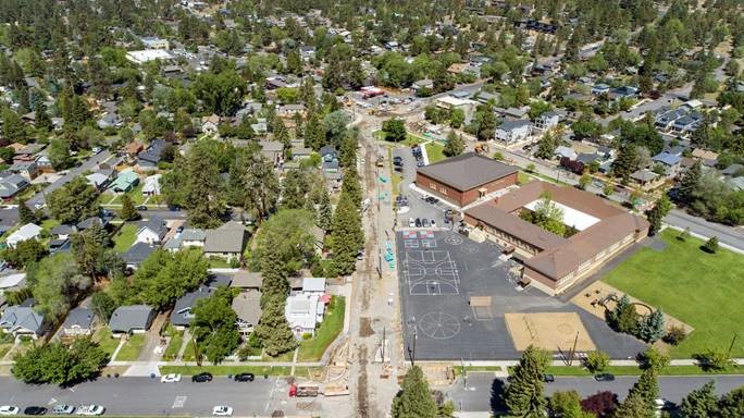 An aerial photo looking northwest down Nashville Avenue as of 6/16/21. Stormwater planters are shaping the new Harmon Blvd. & Nashville Avenue intersections.