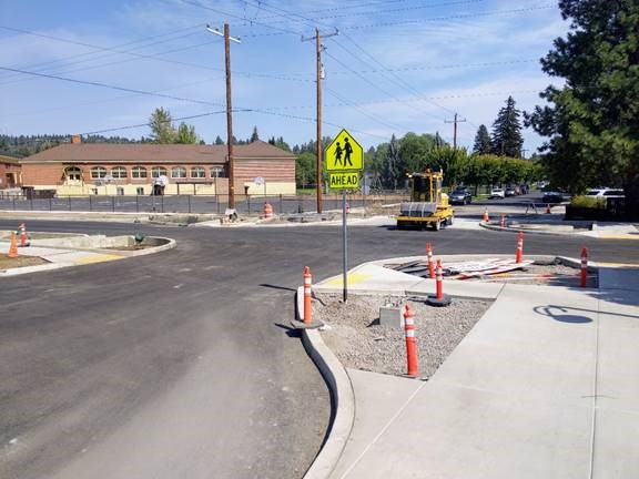 A photo of a street sweeper cleaning up the intersection of Harmon Blvd. and Nashville Ave.