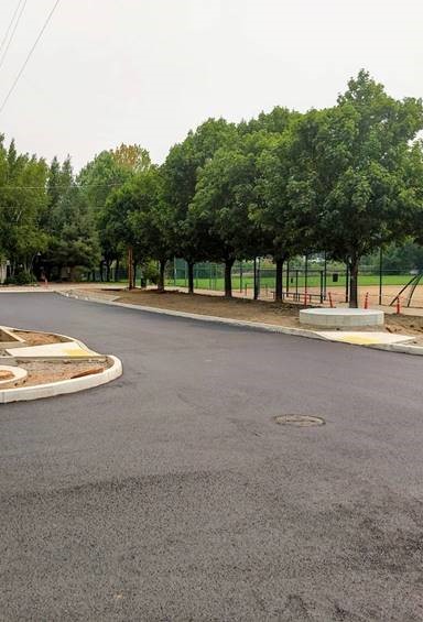 A photo of the first layer of pavement laid at Harmon Blvd. and Nashville Ave.