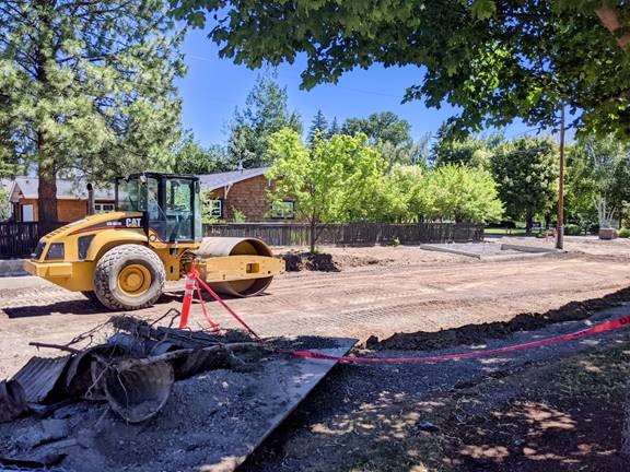 A photo of the subgrade being compacted in preparation for asphalt.