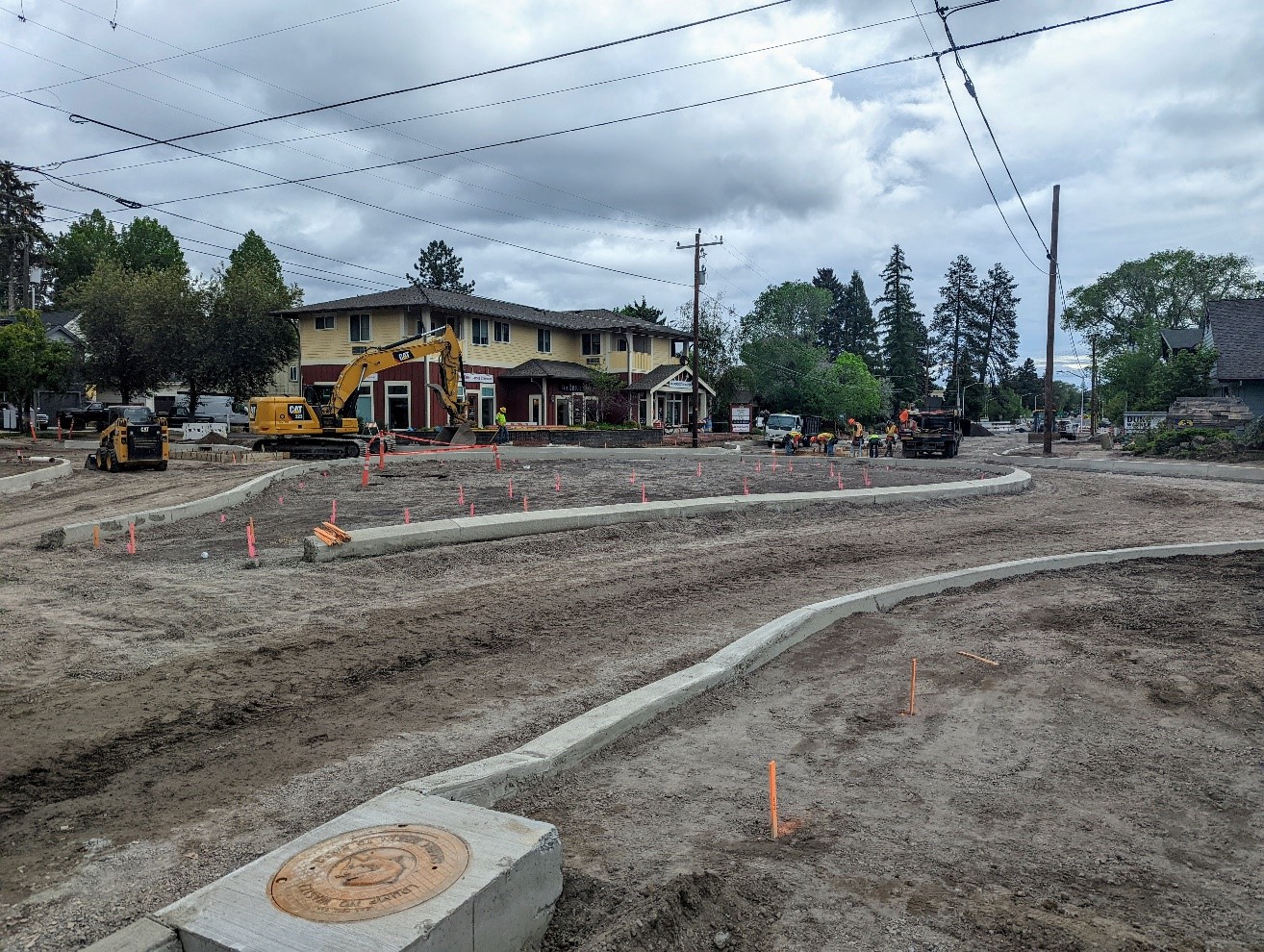 A photo of the curbs being installed for the 11th Street portion of the 