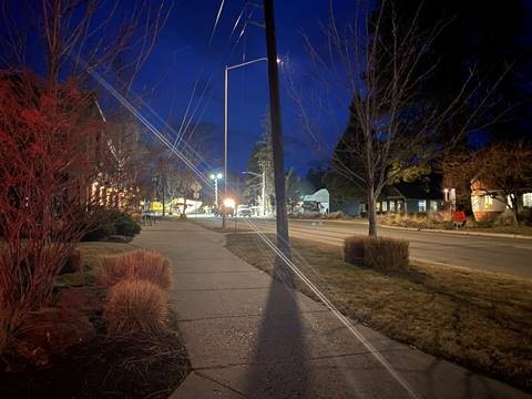 A photo of work crews finishing a shift of night work.