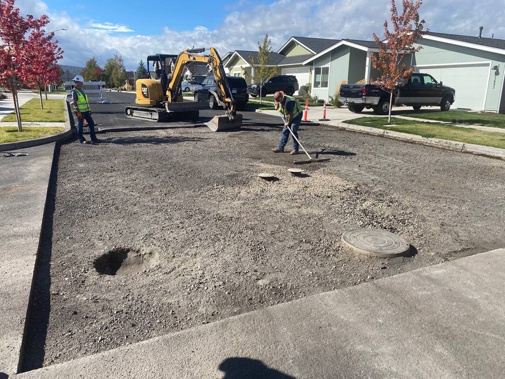 A photo of work crews performing paving restoration work on Hunter Circle.