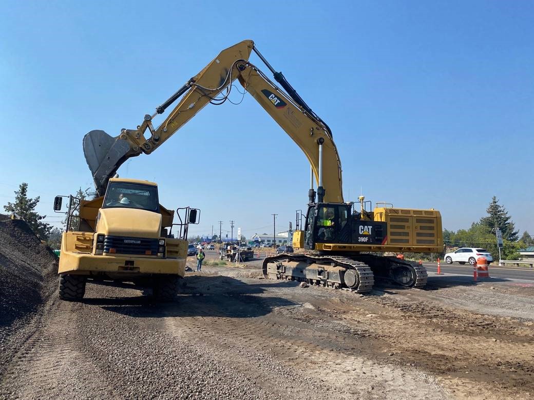 A photo of work crews using large equipment to perform excavation along OR HWY 97.