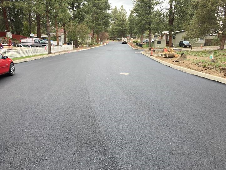 A photo of the first layer of paving along McMullin Drive.