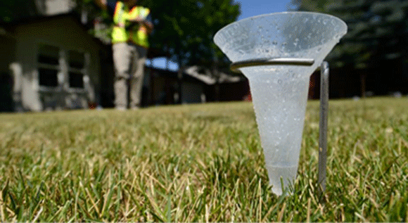 a cone that measures water from a sprinkler.