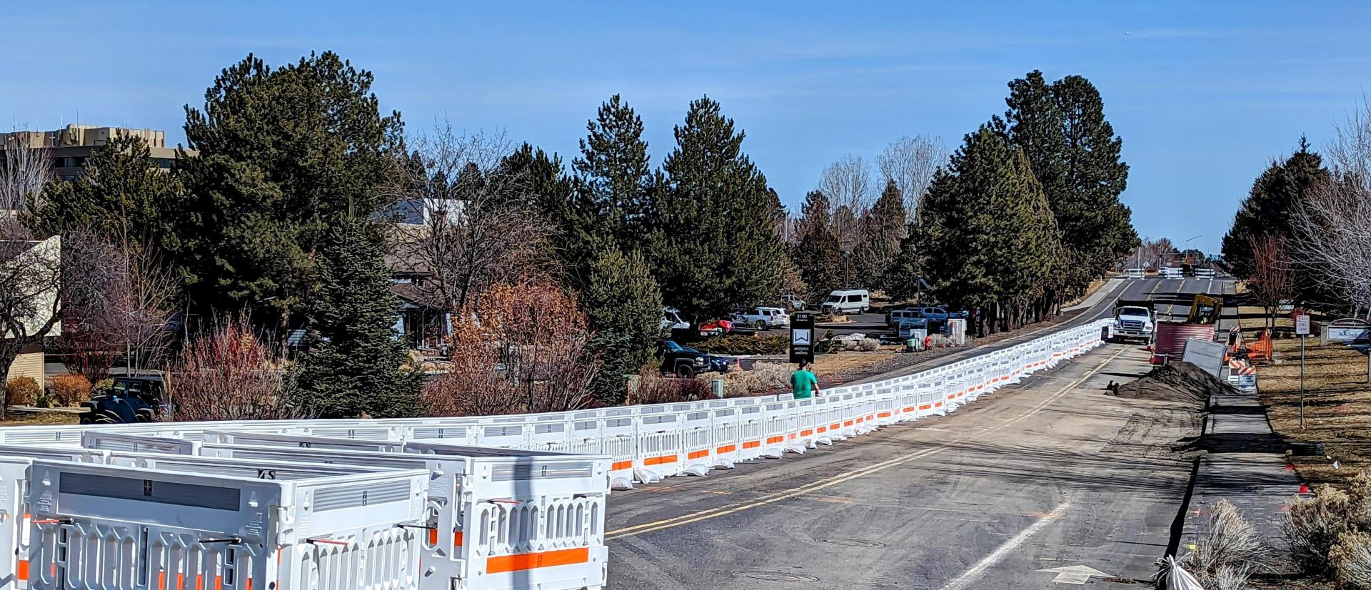 Temporary pedestrian access routes pedestrian around trenching and excavation work on Neff Road near Purcell intersection