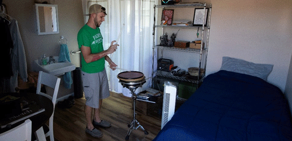 A man playing a drum.