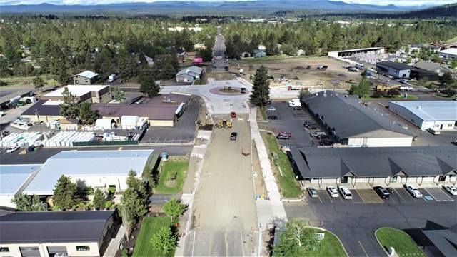 An aerial photo overlooking the 9th Street & Wilson Avenue roundabout facing west.