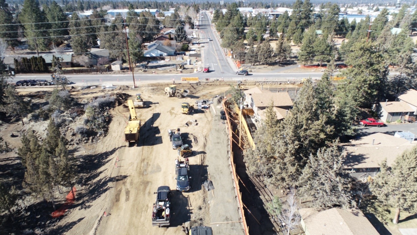 An aerial photo overlooking the intersection of 15th Street and Wilson Avenue facing west. This photo shows the new retaining wall being constructed on the north side of the extension of Wilson Avenue to Wildcat Drive.