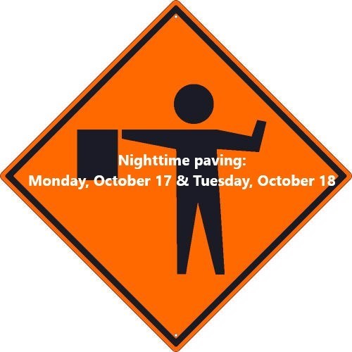 An image of an orange flagger road sign.