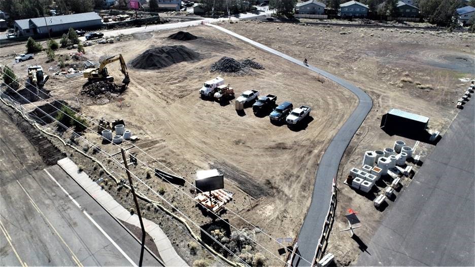 An aerial photo overlooking the temporary bypass bicycle and pedestrian path. There is a cyclist using the path.