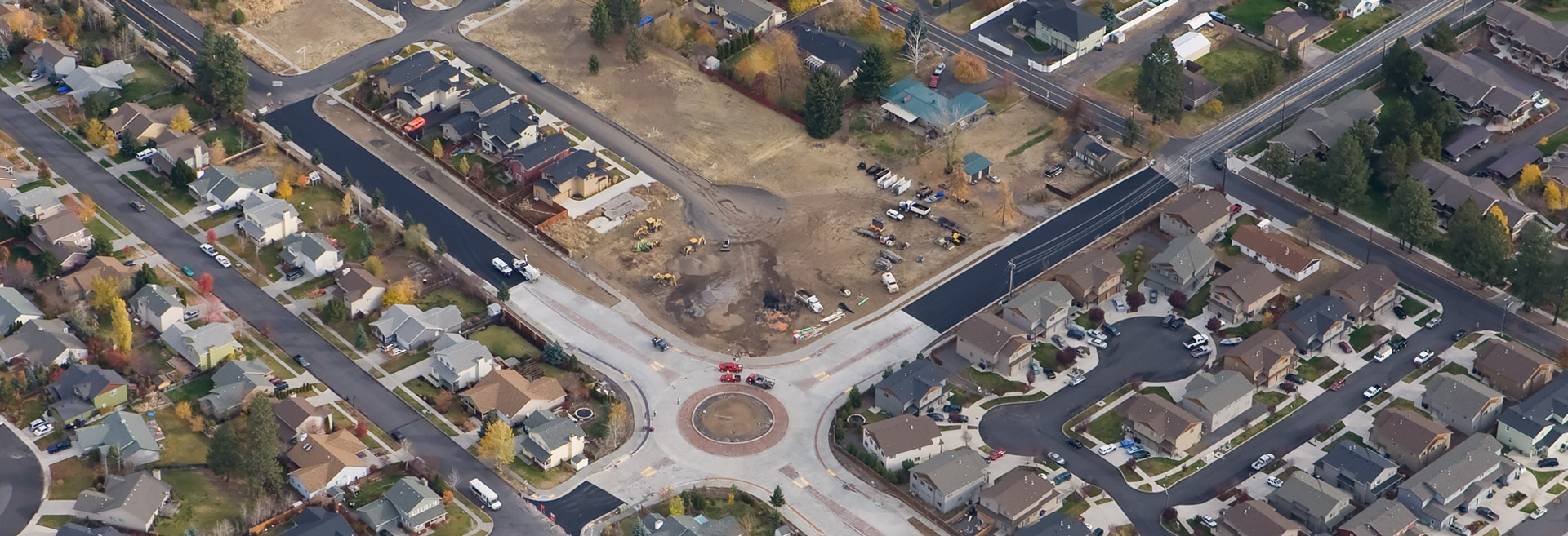Overhead image of a roundabout with houses and development surrounding