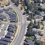 Drone shot of project area, Bulter Market Rd and Wells Acres Rd. intersection. Houses and trees surround the streets.