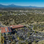 Shot of Juniper Ridge overhead. Les Schwab headquarters in the foreground, juniper trees and sagebrush in the background.