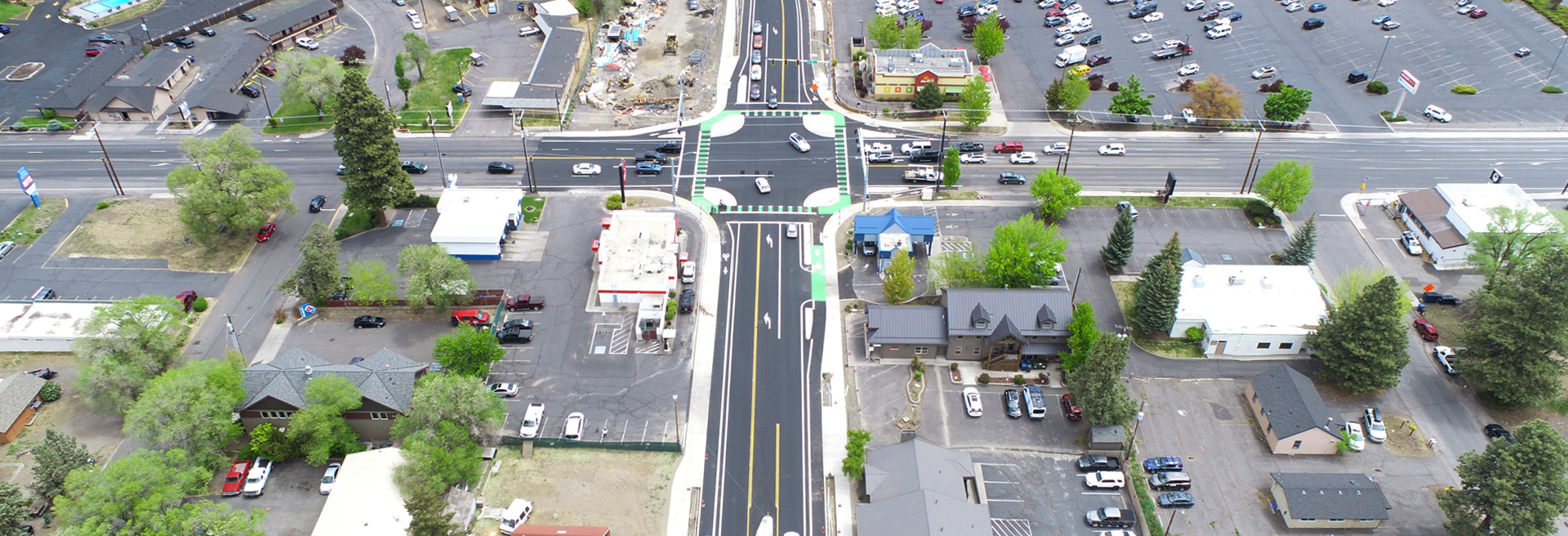 Wilson Avenue intersection looking west. Streets, sidewalk, traffic signals.