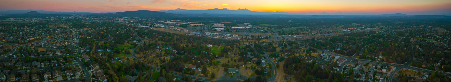 Panoramic image overlooking Bend to the west at sunset.