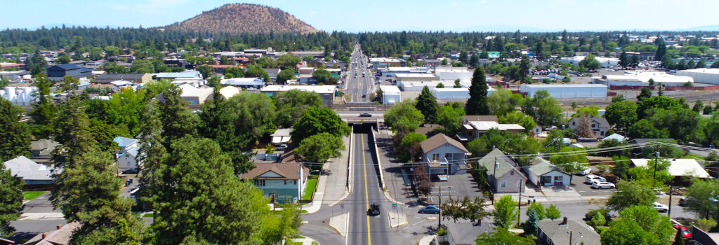 Drone shot of east Bend showing Pilot Butte in the distance