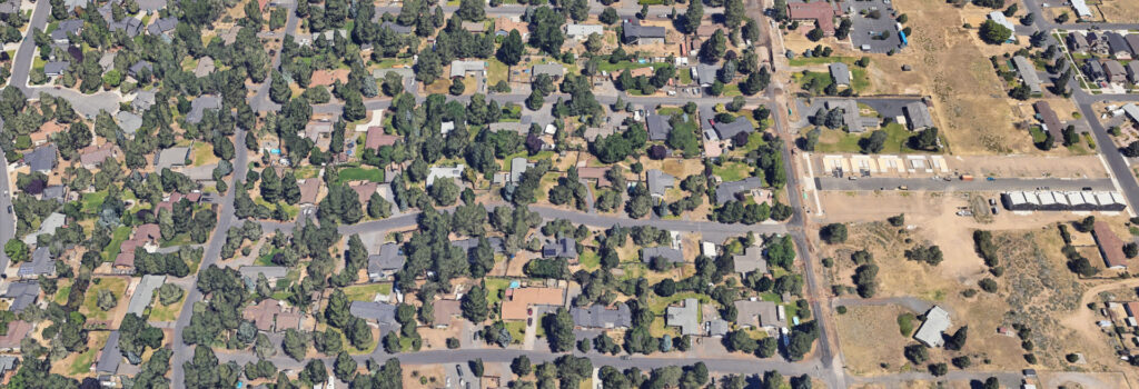 Overhead view of project area, streets, houses, and trees.