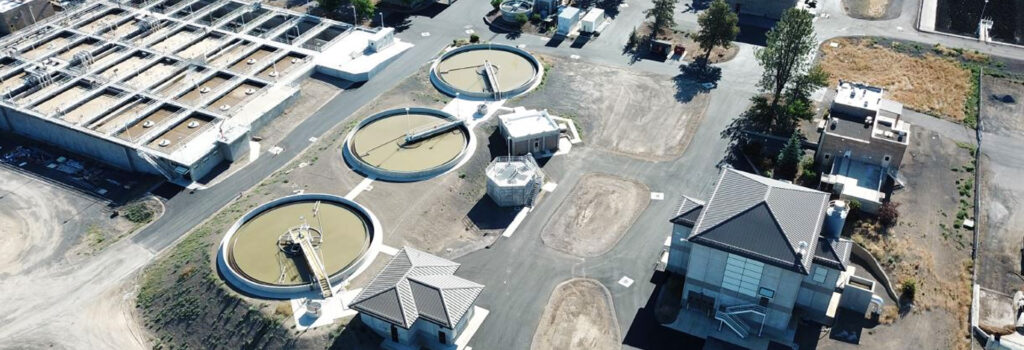 Primary Clarifiers facticity overhead. Clarifiers are round and square in size and contain liquid.