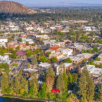 The City of Bend looking east from overhead. Pilot Butte is in the background.