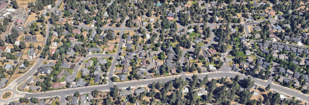 Overhead view of project area, streets, houses, and trees.