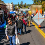 Downtown Bend city street holding an event filled with people