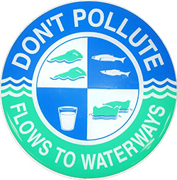 Green and blue seal indicating a storm drain. Text says, "Don't pollute, flow to waterways."