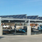 Solar panels on top of the Centennial Parking Garage. Blue sky in the background.