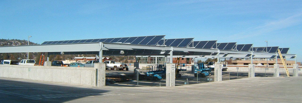 Solar panels on top of the Centennial Parking Garage. Blue sky in the background.