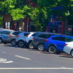 Cars parked in front of businesses in downtown Bend.