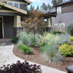 Xeriscaped yard in front of a house.