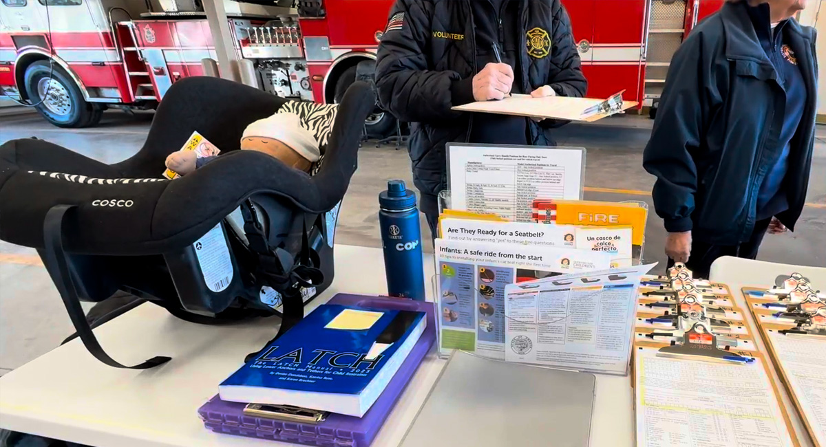 EMS personnel conducting a car seat check.